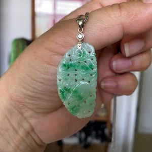 Green and white jade pendant
